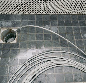 Drain cable ready to clear an indoor drain