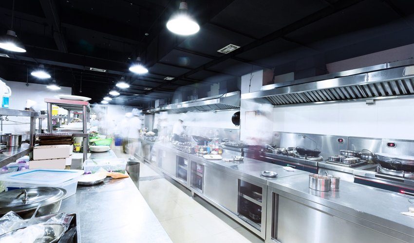 Commercial kitchen with stainless steel units