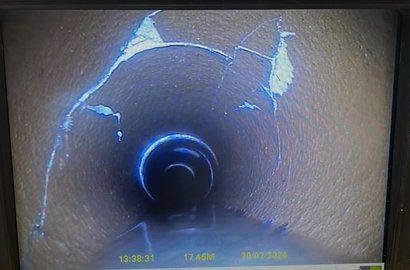CCTV monitor showing the inside of a drain