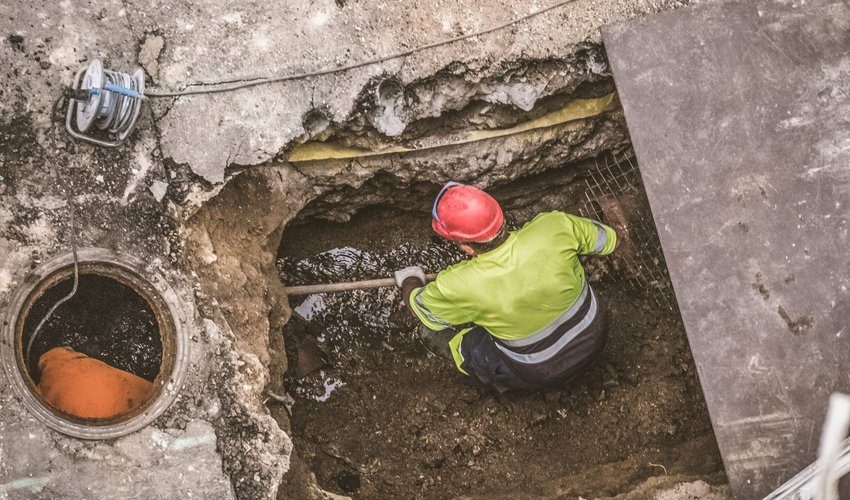 Engineer working on a drain repair