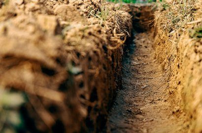 Trench dug to reach a damaged drain