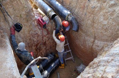 Engineers working in a drain trench